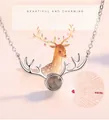 Detailed view of silver reindeer antler necklace with 100 languages I love you stone - Smooth Antler White Gold Color