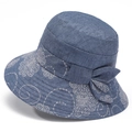 Women's blue sun hat with floral embroidery and a decorative bow on a plain background - M / Blue