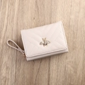 Short pink PU leather wallet for women with V-shaped quilting and golden bee detail - White