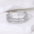 Bracciale rigido aperto in acciaio argento con trama intrecciata su pietra bianca - Color Acciaio
