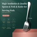 Polished stainless steel serving fork with thickened handle on dark green background - Serving Fork