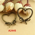 Antique bronze heart-shaped hollow metal frame pendant with bow detail for DIY jewelry - A2445-29*12MM