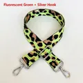Macro shot of neon green leopard print nylon strap with adjustable silver metal hooks - Neon Green + Silver Hook