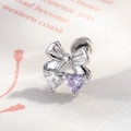 Silver bow heart stud earring with clear and light purple zircon stones on paper background - Bow Purple Heart
