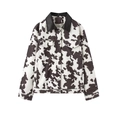 Dames herfstjas met reverskraag, zwart-wit koeienprint en stijlvolle franjes details - S / Zwart Wit Koeienprint