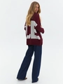 Back view of burgundy oversize knit sweater with large white LE letter jacquard design - S / Red
