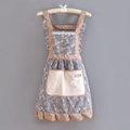 Detail of floral kitchen apron featuring khaki polka dot ruffles and a large beige pocket - Strap Floral Princess Style-Towel Pocket Blue