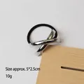 Elastic black hair tie featuring a silver textured geometric metal accessory, 5x2.5cm size - Cross Silver