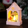 Close-up of LED Christmas lantern with pink church design and glowing Santa scene - Pink Santa