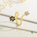 Close-up of golden ring with blue enamel flower and sparkling zircon detail - Adjustable Open / Light Blue Flower