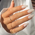 Glossy long coffin press-on nails in nude milky white color shown on hands - Long Coffin / Cream