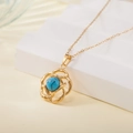 Golden stainless steel necklace featuring a hollow flower pendant with green turquoise stone - Hollow Flower Turquoise Style (137526)