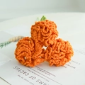 Three handmade orange crochet carnations with fine knit textures and green sepals - Orange Carnation