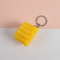 Realistic yellow corn PVC keychain with silver metal ring on pink and white background - Large Corn Cob - Keychain Style