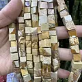 Vue macro de perles carrées en pierre naturelle aux motifs terreux pour bijoux DIY - 4x4mm (Environ 38cm Fil) / Jaspe Paysage