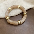Macro view of khaki marble-textured acrylic segments with polished gold metal beads - Coffee (Marble Texture)
