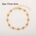 Golden daisy bracelet with yellow and orange enamel flowers, length 17cm+5cm - Yellow and Red Daisy (Gold Tone)