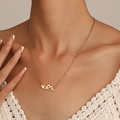 Elegant gold necklace with Arabic calligraphy pendant worn by a model in a close-up view - Arabic Calligraphy Pendant Necklace-KC Gold (24)