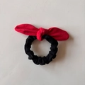 Elastic black hair tie featuring a vibrant red suede bow in a minimalist style - Red