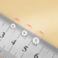 Cuentas espaciadoras planas de plata S925 de 4mm, 5mm y 6mm sobre una regla graduada - Plata de ley 925 / Cuenta de Platillo Volante de 4mm