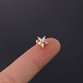 Golden daisy flower cartilage stud with colorful iridescent petals held by hand - AB Color (3#)