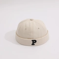 Detail of beige cotton pumpkin hat with black P letter embroidery and eyelet ventilation - Beige / 1-4 Years