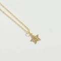 Close-up of golden star pendant featuring a micro-inlaid diamond and Virgin Mary relief - Five-pointed Star