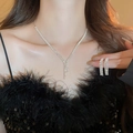 Elegant 2-piece silver zircon tassel necklace and earrings set worn by a female model - Necklace #10 - Silver (two-piece Set)
