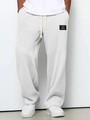 Detail of grey waffle knit fabric joggers showing texture and black classic wear patch - S / White