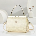 Close-up of premium cream faux crocodile skin texture and elegant gold clasp on evening bag - Stone Pattern Beige