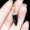 Polished black faceted obsidian bullet pendant with a gold-plated metal hook clasp - Obsidian
