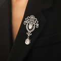 Baroque vintage brooch with silver base and crystal pendant pinned on black blazer - Silver Baroque Style (8244)
