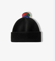 Close-up of a black knitted beanie featuring a vibrant multi-colored faux fur pompom - One Size / Black