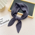 Dark grey pleated silk scarf with fine texture shown on a decorative tray - Dark Gray