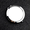 Portable silver round compact makeup mirror in polished metal finish on black background - Solid Bottom / Silver