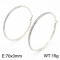 Detail of 70mm silver hoop earrings featuring pavé rhinestones and hollow geometric design - 70x3mm / Steel