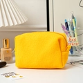 Detailed view of the bright yellow waffle texture fabric and durable zipper closure - Yellow