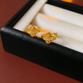 Macro shot of gold-plated hollow clover earrings on a premium black leather jewelry box - Gold (Hollow Clover Style)