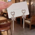 Elegant silver long tassel drop earrings with hollow heart and bow knot diamond design - Heart Bow Tassel Studs