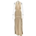 Detailed view of backless halter dress with side split and pleated waist detail in beige - S / Gold