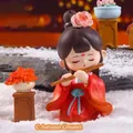 Ancient style figurine of a lady in red Hanfu playing bamboo flute on a snowy background - Yang Guifei Flute Playing Figurine