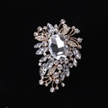 Elegant gold flower brooch featuring sparkling oval crystal and marquis rhinestones - MM-BR-0028 / Gold