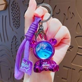Portachiavi a forma di orso spaziale viola metallizzato con cinturino intrecciato - Viola