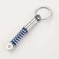 Dettaglio del portachiavi ammortizzatore argento con molla blu e anello in metallo - Blu