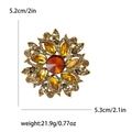 Vintage floral sunburst brooch in amber crystal and gold finish, sized 5.2cm x 5.3cm - Brown