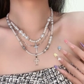 Three-layer necklace with white faux pearls and silver cross pendants on female neck - 75#DX0332A (Layered Artificial Pearl Cross Necklace)