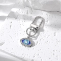 Detail of evil eye keychain with blue enamel and sparkling rhinestones on stone base - Silver Enamel Drip Evil Eye