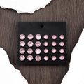Sparkling pink round zircon stud earrings set on a black display card over stone - Purple Crystal 12 Pairs Stud Earring Set