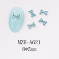 Macro detail of 8x5mm light blue rhinestone bow nail art charm with silver metal base - Exquisite Small Rhinestone Inlay Bow (A621)