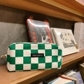 Detailed close-up of green checkered canvas pencil case on a wooden shelf - Green Checkerboard (Medium)